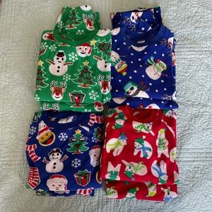 4 pairs of Unisex Children’s Place holiday pajamas